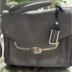 Coach handbag with turn lock closure